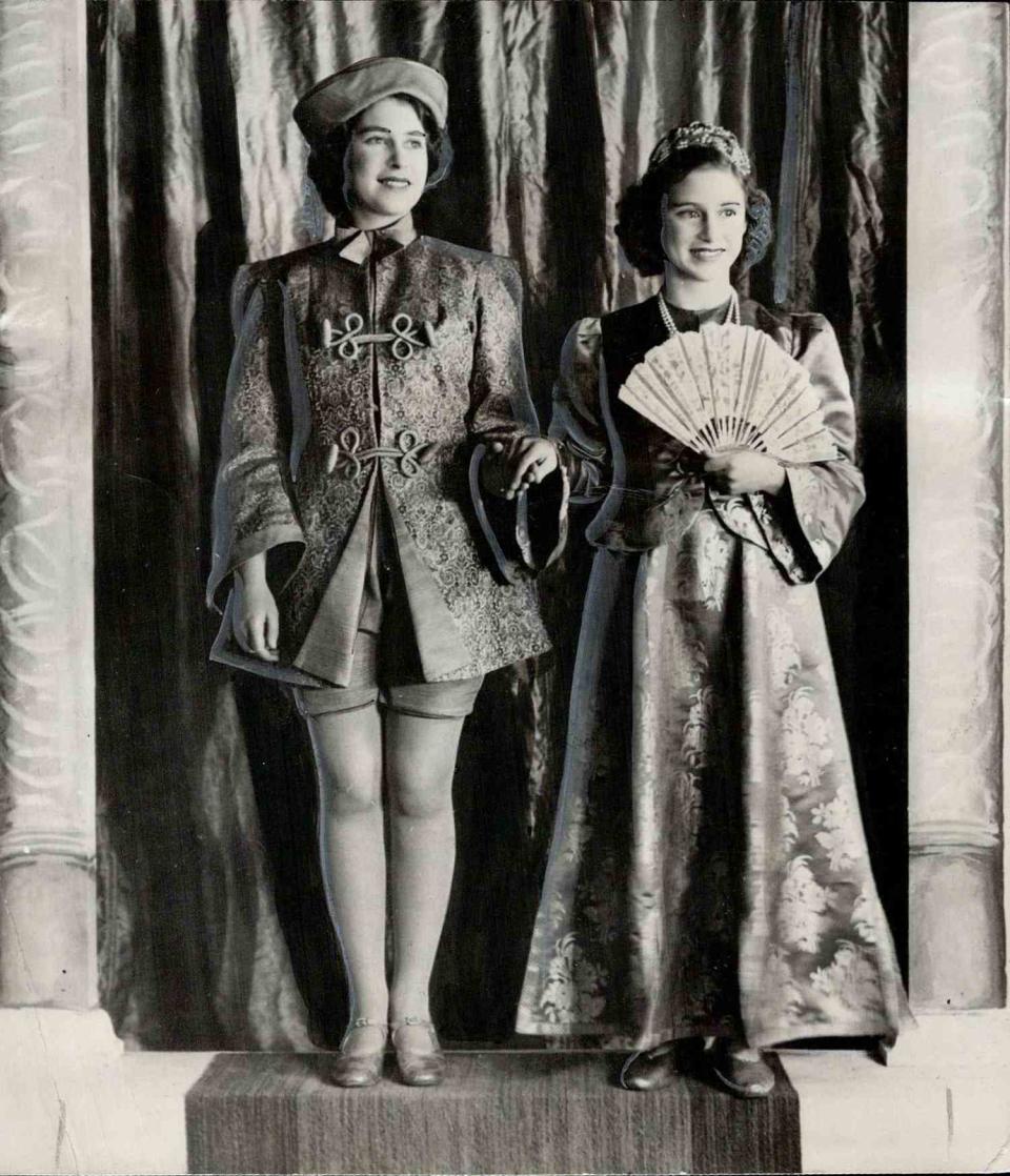 <p>Queen Elizabeth, then Princess Elizabeth, and her sister put on their fancy dress for World War II-era Christmas plays at Windsor Castle. The series of pantomimes from 1941 through 1944 raised money for the Royal Household Wool Fund, which supplied knitting wool to make comforters for soldiers.</p>