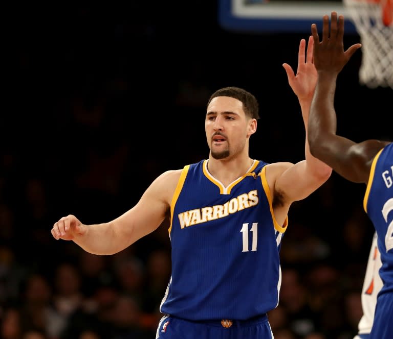 Klay Thompson of the Golden State Warriors celebrates after scoring a point