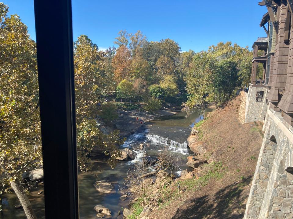 The Grand Bohemian Lodge Greenville sits on the banks of the Reedy River.