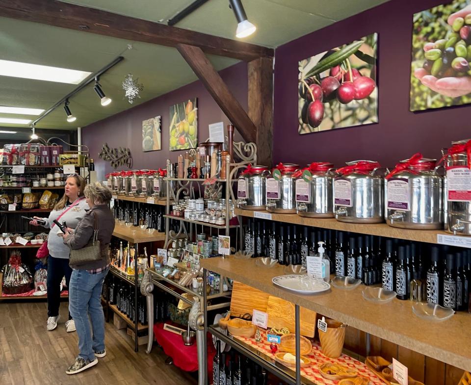 Shoppers at the Olive Scene can taste dozens of olive oils and balsamic vinegars.