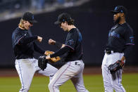 Miami Marlins' Brian Anderson, center, celebrates with teammates after a baseball game against the New York Mets on Tuesday, Sept. 27, 2022, in New York. The Marlins won 6-4. (AP Photo/Frank Franklin II)