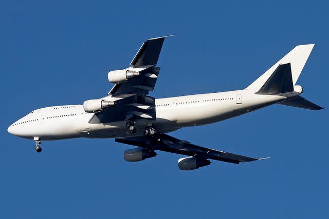 <p>Andrew Holt/Getty</p> Stock image of a plane in-flight.