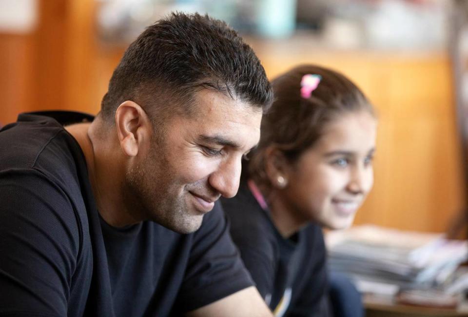 Kawa Barakazai shares a light moment with daughter Maryam in their new Cambria home. The Barakazais spent more than two years hiding from the Taliban in Afghanistan and Pakistan before arriving in the United States on Sept. 6, 2023.