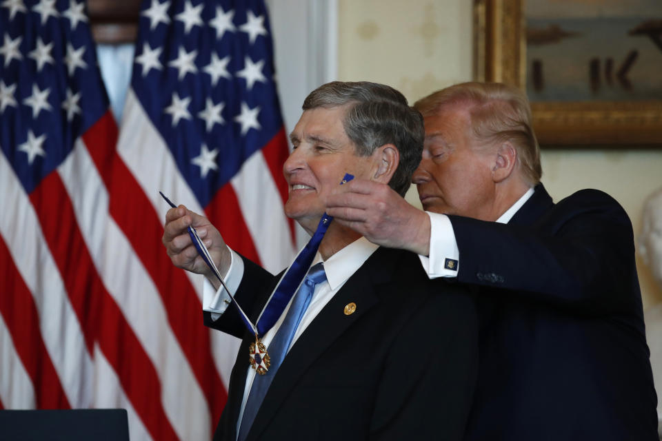 President Donald Trump speaks presents the Presidential Medal of Freedom to Jim Ryun, in the Blue Room of the White House, Friday, July 24, 2020, in Washington. (AP Photo/Alex Brandon)