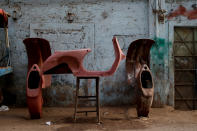 <p>Parts of Vespa scooters are seen outside a workshop in Karachi, Pakistan Feb. 24, 2018. (Photo: Akhtar Soomro/Reuters) </p>