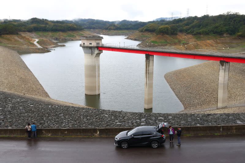 Tourists visit the Baoshan second reservoir amid low water levels during an islandwide drought, in Hsinchu, Taiwan