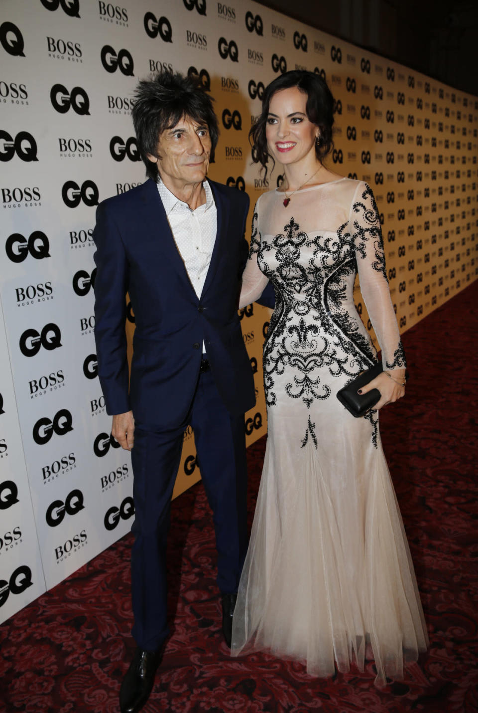 Ronnie Wood and his wife Sally Humphreys looked as sharp as ever in their red carpet ensembles. Ronnie opted for a navy blue suit sans tie while Sally looked like she’d stepped out of a fairy tale in a tulle embellished gown. [Photo: Rex]