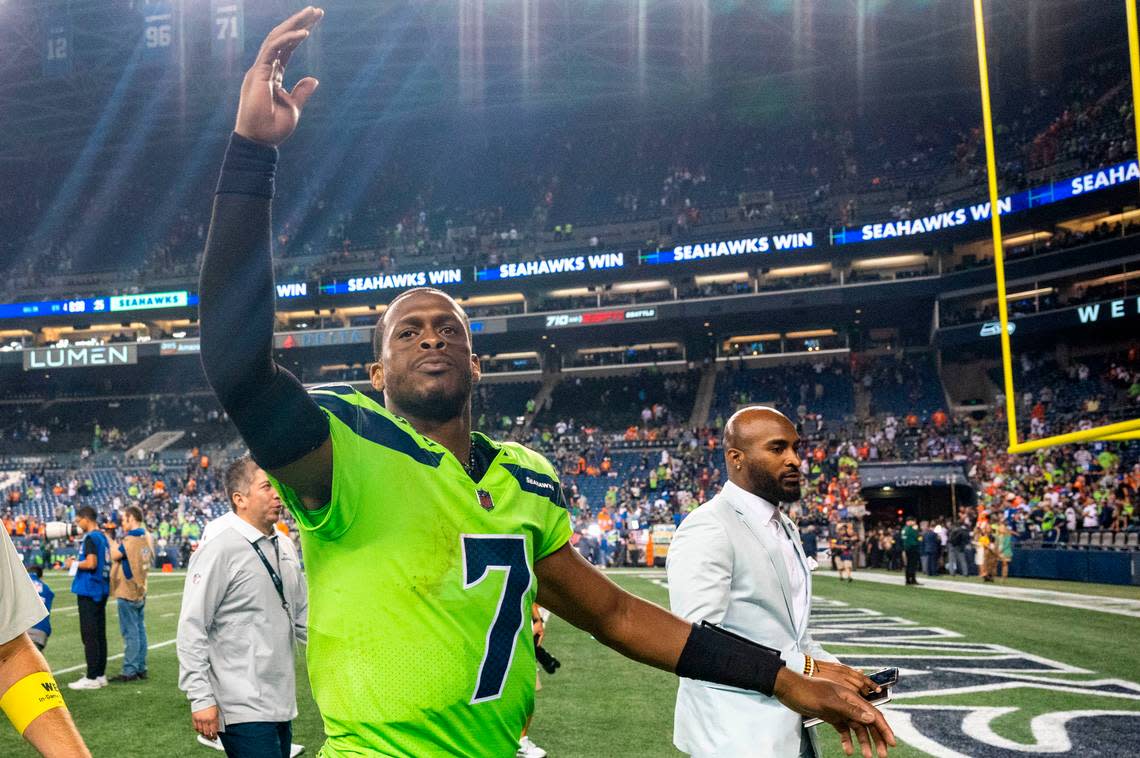 Seahawks quarterback Geno Smith (7) responds to the crowds chants of “Geno, Geno, Geno” as he walks off the field after Seattle beat Denver, 17-16, in an NFL game on Monday, Sept. 12, 2022, at Lumen Field in Seattle.