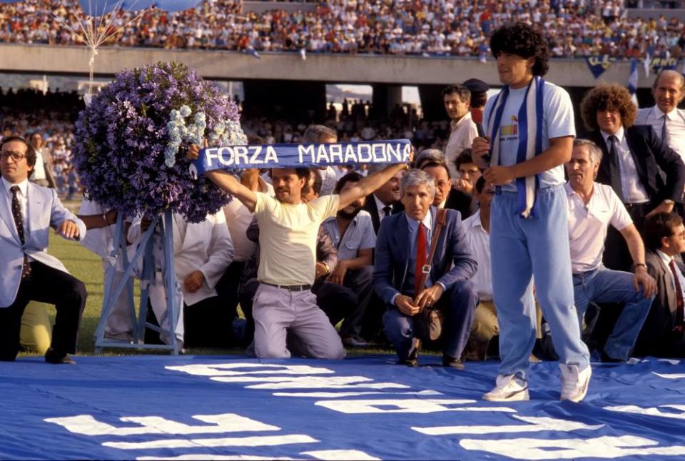 Thousands of Napoli fans greet Maradona in July 1984 at the San Paolo stadium.