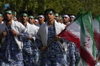 Volunteer troops of the Iranian army march during Army Day parade at a military base in northern Tehran, Iran, Wednesday, April 17, 2024. In the parade, President Ebrahim Raisi warned that the "tiniest invasion" by Israel would bring a "massive and harsh" response, as the region braces for potential Israeli retaliation after Iran's attack over the weekend. (AP Photo/Vahid Salemi)