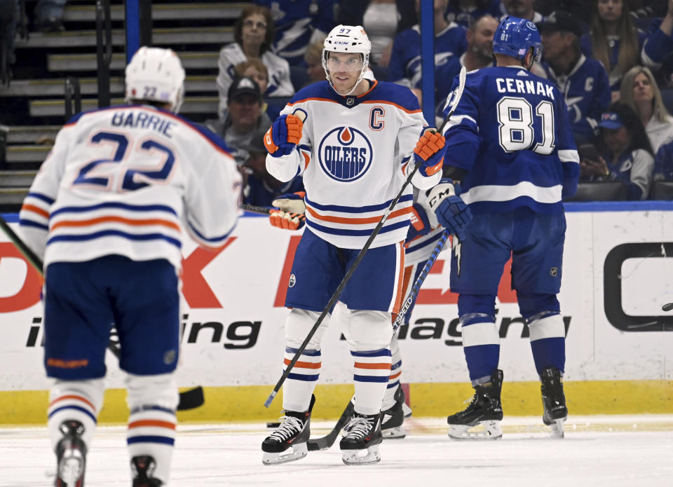 Edmonton Oilers center Connor McDavid (97) celebrates his second period goal during an NHL hockey game against the Tampa Bay Lightning Tuesday, Nov. 8, 2022, in Tampa, Fla. (AP Photo/Jason Behnken)