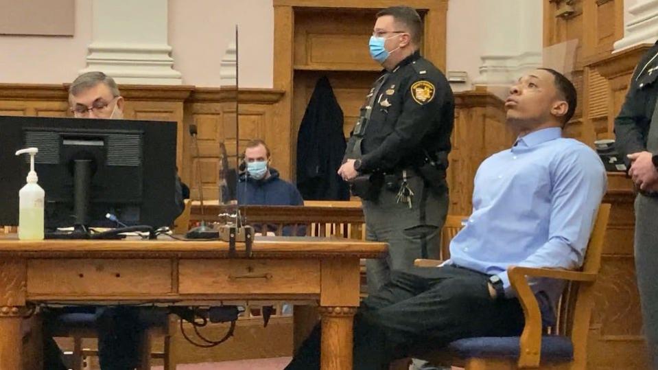 Javier Blood looks to the ceiling in a sigh of relief after his acquittal on all charges in the shooting death of 65-year-old Jenny Norris, of Canton.