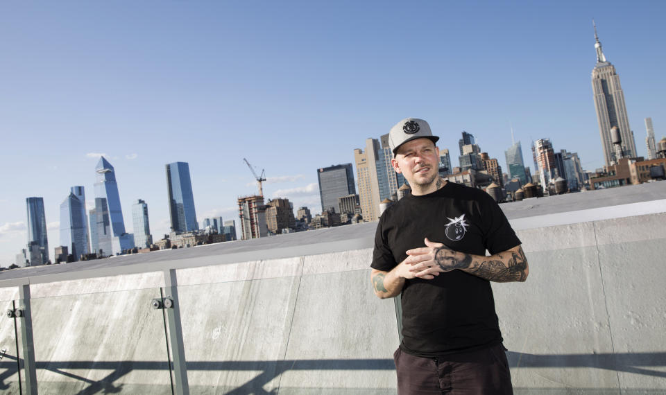This July 12, 2019 photo shows Puerto Rican rapper, writer, and filmmaker René Pérez Joglar, known professionally as Residente, in New York. Residente studied intensely with professors at Yale University and New York University to create his second solo project. The untitled album will be released in November. (Photo by Brian Ach/Invision/AP)