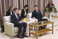 Oleg Kozhemyako, left, Russia's governor of the Maritime Territory Administration, speaks with Ji Kyong Su, North Korea's vice minister of External Economic Relations, after Kozhemyako arrived at the Pyongyang International airport in Pyongyang, North Korea, Monday, Dec. 11, 2023. (AP Photo/Jon Chol Jin)