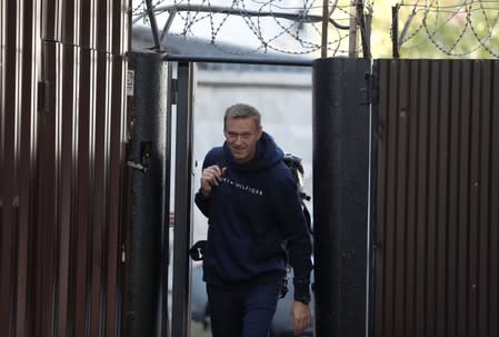 Russian opposition leader Navalny walks out of a detention centre in Moscow