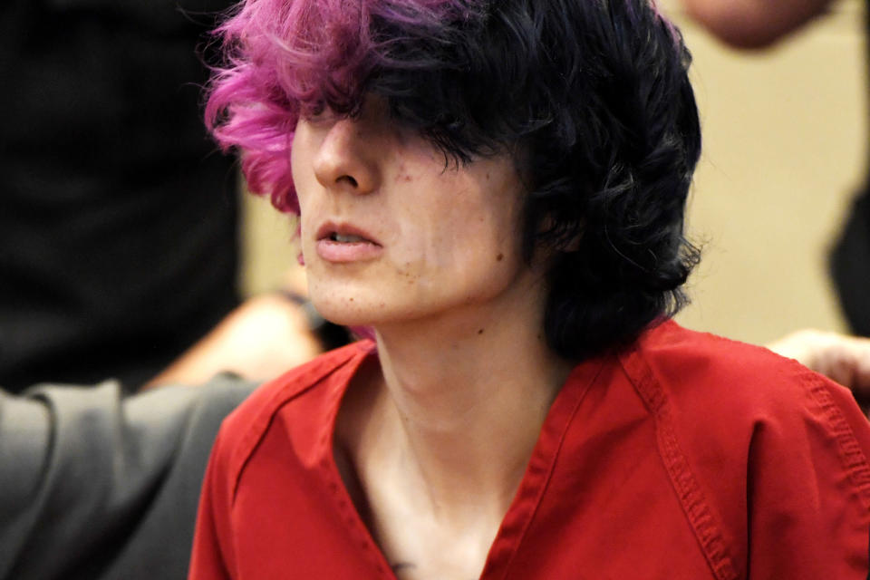 FILE - In this Wednesday, May 8, 2019 file photo, Devon Erickson, an accused STEM School shooter, appears at the Douglas County Courthouse in Castle Rock, Colo. Erickson and another suspect in the suburban Denver school shooting are due back in court as prosecutors file charges in the violent attack that killed a student and wounded multiple others. Prosecutors also are expected to decide Friday, May 10, whether to charge the younger suspect, Maya McKinney, 16, as an adult. (Joe Amon/The Denver Post via AP, Pool, File)