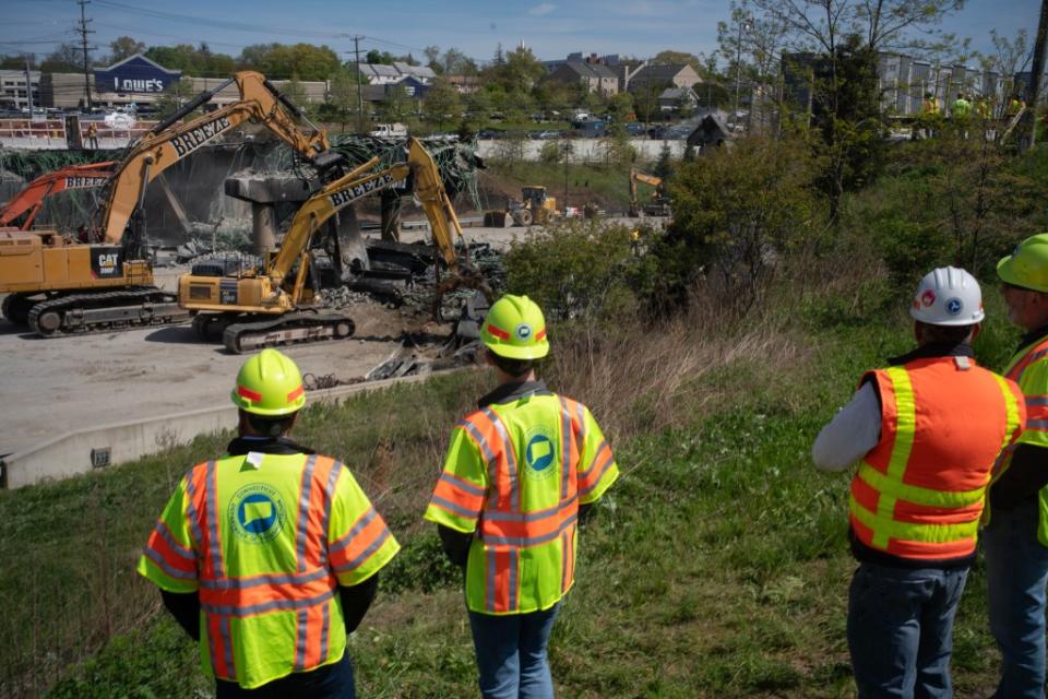 Crews will remain at the scene until at least Monday, when I-95 could reopen. Douglas Healey