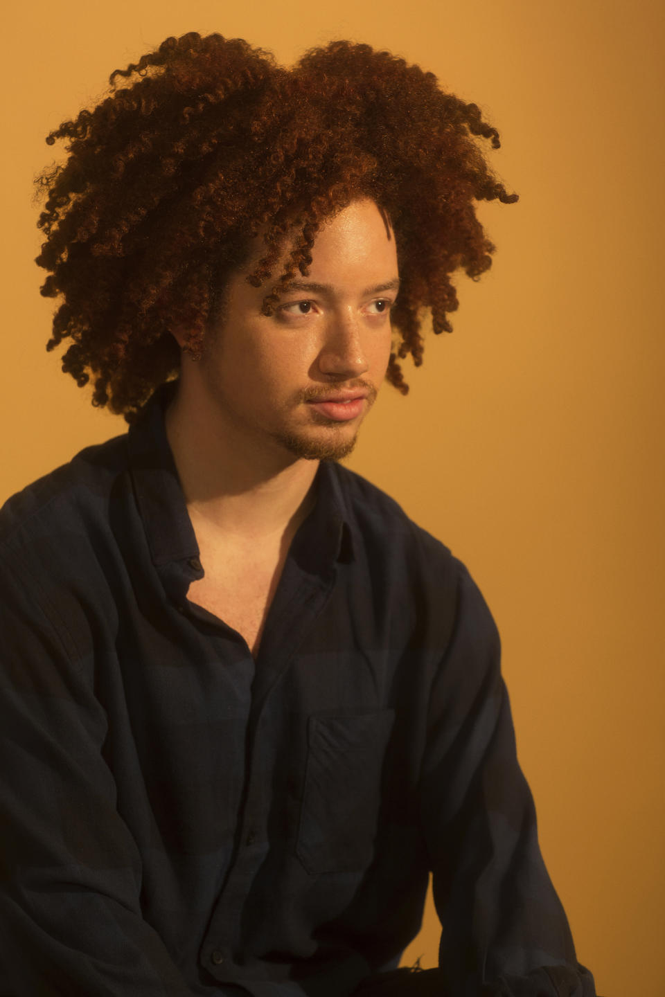 Communications student Brandon Hernandez knows just how powerful social media can be in influencing the younger generation's views on natural hair. (Photo: Natalia Mantini)