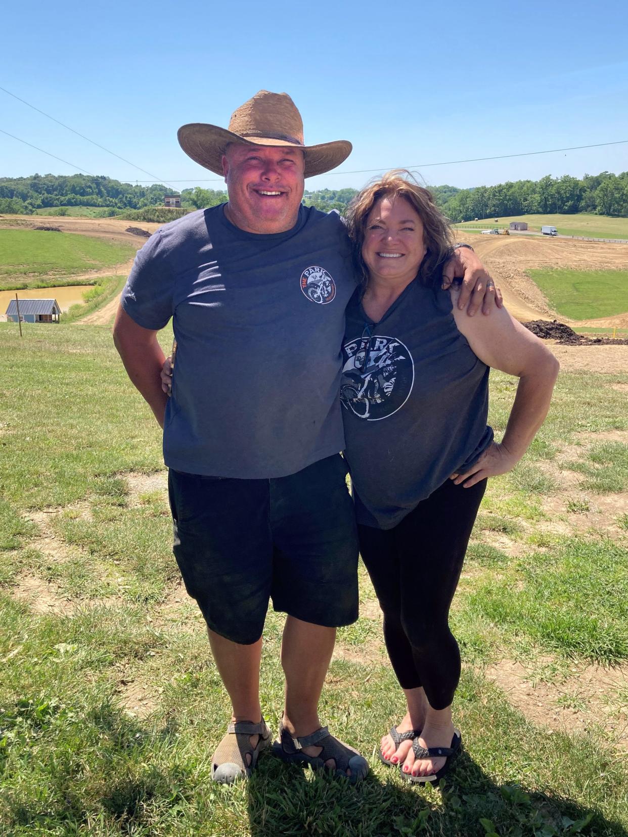 Co-owners David Grear, left, and Robin Grear stand in front of their motorsports track off Kopchak Road in Falls Township. The facility will host a Parts Unlimited Buckeye Series event on June 24-25, which is open to the public.