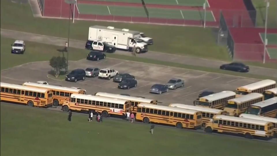 In this image taken from video law enforcement officers respond to a high school near Houston after an active shooter was reported on campus, Friday, May 18, 2018, in Santa Fe, Texas. The Santa Fe school district issued an alert Friday morning saying Santa Fe High School has been placed on lockdown. (KTRK-TV ABC13 via AP)