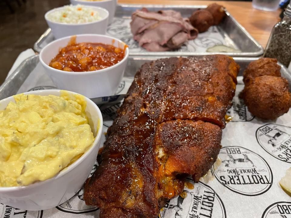 Trotter's Whole Hog BBQ is a downtown Sevierville barbecue house that serves up tasty portions of smoked meats for the plate and for the bun, with a generous selection of beer taps to boot.