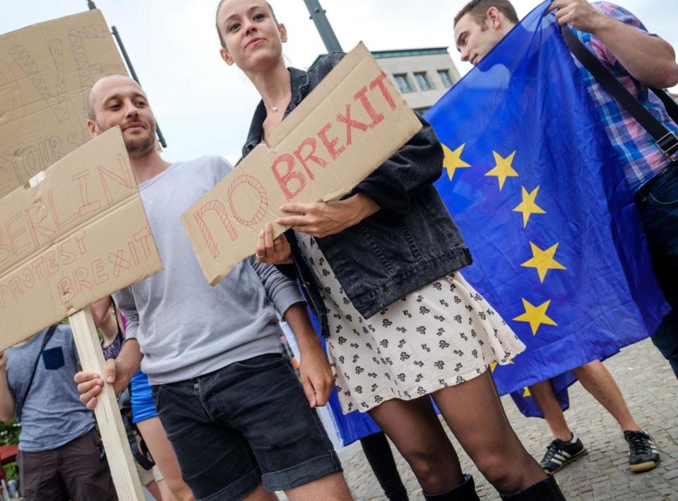 British expats hold up signs to protest for the United Kingdom to remain in the European Union on 2 July 2016 in Berlin, Germany (Getty)