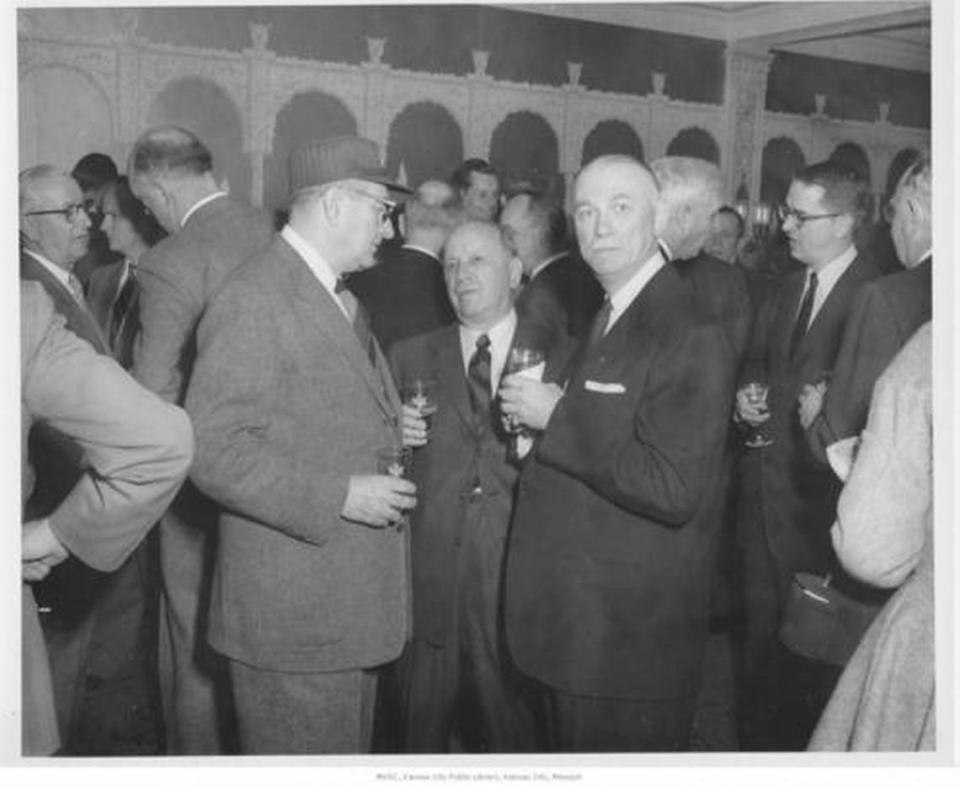 Barney Allis, middle, with City Manager L.P. Cookingham, left, and Nathan Rieger of Mercantile Bank and Trust Co. at a reception for the new Auditorium Plaza Garage in December 1955.