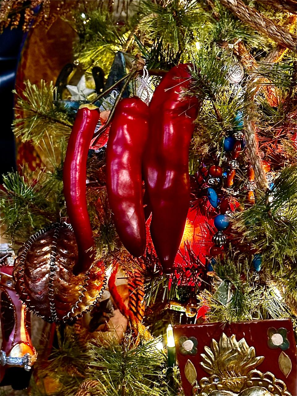 Decorations are seen on the New Mexico-themed tree at Ku-Tips Nursery & Gift Shop in Farmington.