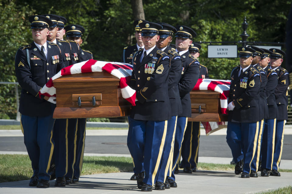 The 3rd Infantry Regiment, also known as the Old Guard, casket teams carry the remains of two unknown Civil War Union soldiers to their grave at Arlington National Cemetery in Arlington, Va., Thursday, Sept. 6, 2018. The soldiers were discovered at Manassas National Battlefield and will be buried in Section 81. Arlington National Cemetery opened the new section of gravesites with the burial. (AP Photo/Cliff Owen)