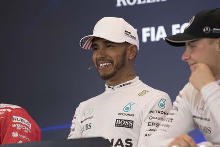 Oct 21, 2017; Austin, TX, USA; Mercedes driver Lewis Hamilton (44) of Great Britain is interviewed after the qualifying session for the United States Grand Prix at Circuit of the Americas. Mandatory Credit: Jerome Miron-USA TODAY Sports