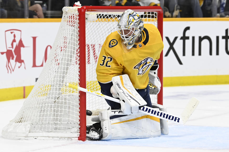 A shot by Toronto Maple Leafs center John Tavares (not shown) gets past Nashville Predators goaltender Kevin Lankinen (32) for a goal during the first period of an NHL hockey game Sunday, March 26, 2023, in Nashville, Tenn. (AP Photo/Mark Zaleski)