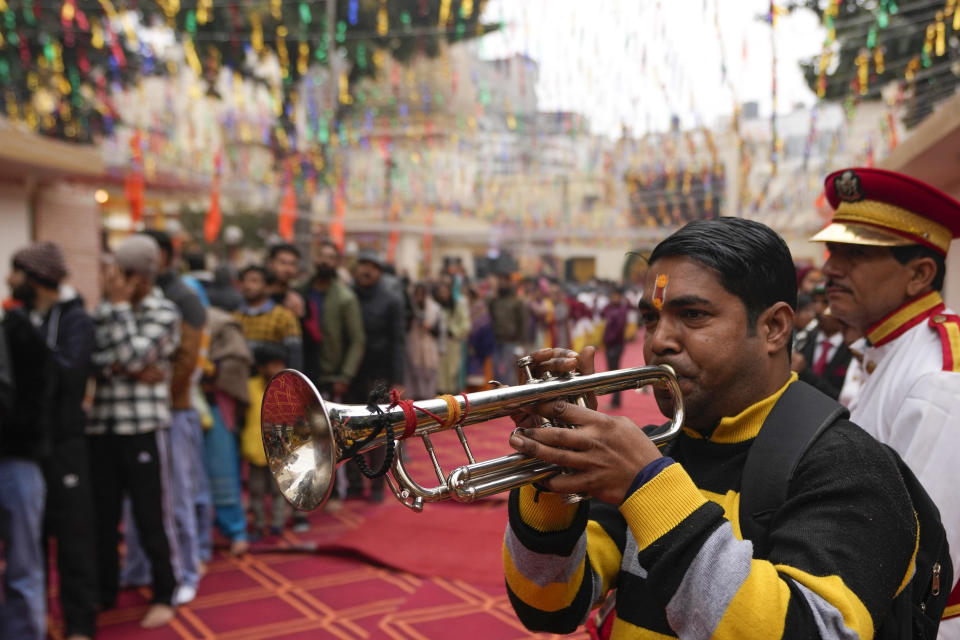 Member of a traditional brass band performs at Raghutnath temple in Jammu, India, during the opening of a temple dedicated to Hindu deity Lord Ram, in Ayodhya, Monday, Jan.22, 2024. Indian Prime Minister Narendra Modi on Monday opened a controversial Hindu temple built on the ruins of a historic mosque in the holy city of Ayodhya in a grand event that is expected to galvanize Hindu voters in upcoming elections. (AP Photo/Channi Anand)