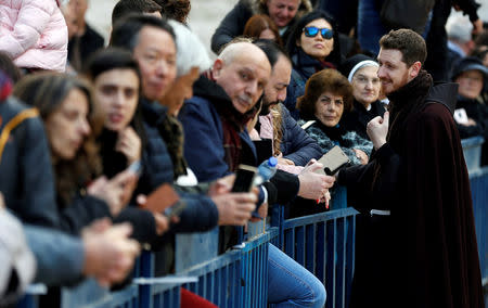 People attend Christmas celebrations at Manger Square outside the Church of the Nativity in Bethlehem, in the Israeli-occupied West Bank December 24, 2018. REUTERS/Mussa Qawasma