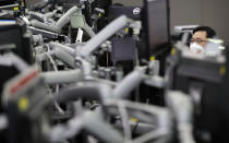 A currency trader watches computer monitors at the foreign exchange dealing room in Seoul, South Korea, Friday, Aug. 14, 2020. Asian shares were mixed on Friday as investors studied fresh data out of China showing its recovery remains subdued. (AP Photo/Lee Jin-man)