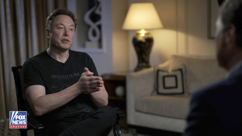 In this image released by FOX News Elon Musk gestures as he is interviewed by FOX News host Tucker Carlson on Thursday, April 13, 2023. The billionaire Twitter owner told Carlson in a segment aired Monday night, April 17, that he plans to create an alternative to the popular AI chatbot ChatGPT that he is calling “TruthGPT,” which will be a "maximum truth-seeking AI that tries to understand the nature of the universe.” (FOX News via AP)