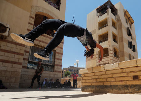 Mariam Emad from Parkour Egypt "PKE" practices her parkour skills around buildings on the outskirts of Cairo, Egypt July 20, 2018. REUTERS/Amr Abdallah Dalsh