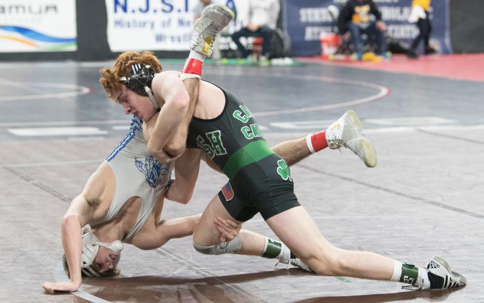 Camden Catholic's Jackson Young controls Williamstown's John Hildebrandt during a 120 lb. bout of the pre-quarterfinal round of the 2022 NJSIAA Wrestling Championships held at Boardwalk Hall in Atlantic City on Thursday, March 3, 2022.  Young defeated Hildebrandt, 1-0.