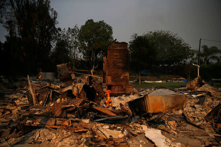 A destroyed home is seen as the Woolsey Fire continues to burn in Malibu, California, U.S. November 10, 2018. REUTERS/Eric Thayer