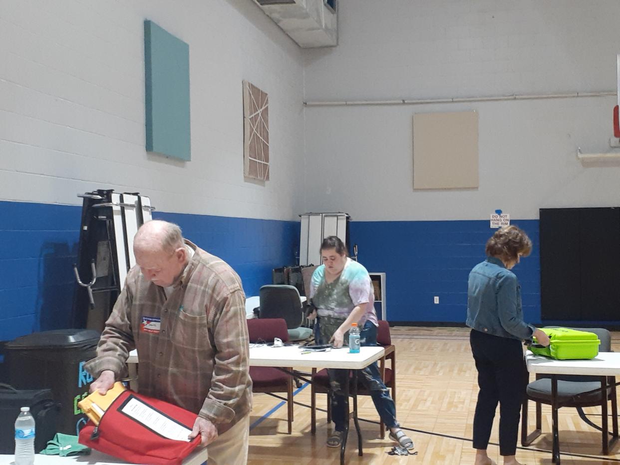 Poll workers wrap up and pack away voting machinery in the polling place for Precinct 15 at the Ross Center Tuesday evening. Dave Hall, on the right, Kayla Sardegna and Cathy Schulert ready the equipment for the trip to the Delaware County Building. The crew said 101 voters cast ballots in the primary election.