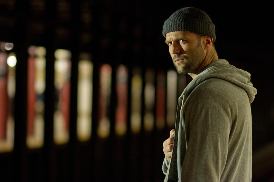 Jason Statham peers towards potential danger in "Safe"