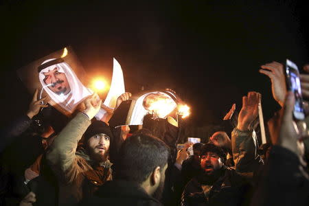 People protest in front of Saudi Arabia's embassy during a demonstration in Tehran January 2, 2016. Iranian protesters stormed the Saudi Embassy in Tehran early on Sunday morning as Shi'ite Muslim Iran reacted with fury to Saudi Arabia's execution of a prominent Shi'ite cleric. REUTERS/TIMA/Mehdi Ghasemi/ISNA