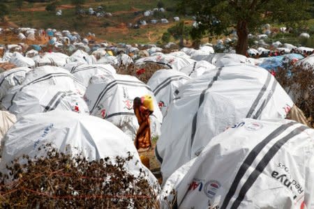 FILE PHOTO: An Ethiopian girl carries water at the Somare refugee camp on the Ethiopian-Kenyan border near the town of Moyale, Kenya March 27, 2018. Picture taken March 27, 2018. REUTERS/Baz Ratner/File Photo