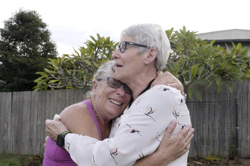 Christine Archer, right, and her sister Gail Baker cry as they are reunited in Bowraville, Australia Wednesday, May 20, 2020. Australia had rejected Archer’s request for permission to fly from New Zealand four times before her story attracted media attention. Her only sister Baker was diagnosed with incurable ovarian cancer in late March after both countries stopped international travel. Baker has perhaps weeks to live. Archer was eventually allowed to fly to Sydney and spent only a week in hotel quarantine before testing negative for the coronavirus. (AuBC via AP)