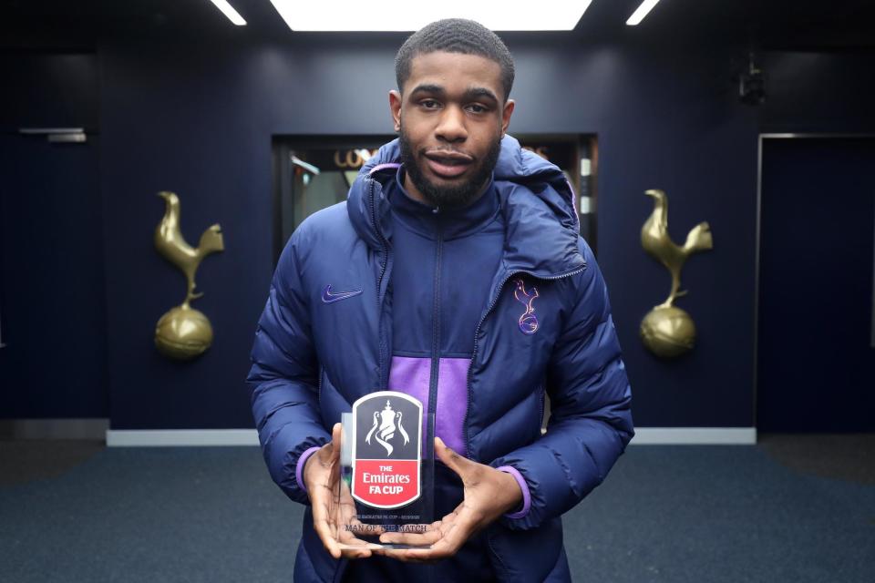 Man of the match: Tanganga poses with his award after Middlesbrough win (Tottenham Hotspur FC via Getty Images)