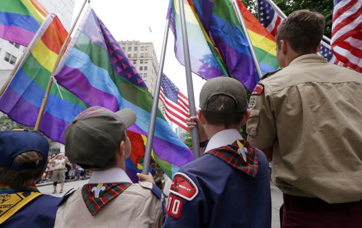 Cub Scouts and Boy Scouts prepare to lead marchers while waving rainbow-colored flags at the 41st annual Pride Parade in Seattle in June 2015, two days after the U.S. Supreme Court legalized gay marriage nationwide. (Photo: Elaine Thompson/AP)