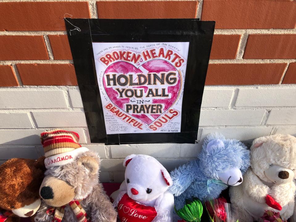 A memorial for the 12 victims of the Philadelphia rowhome fire sits near the site of the blaze in Philadelphia's Fairmount section.