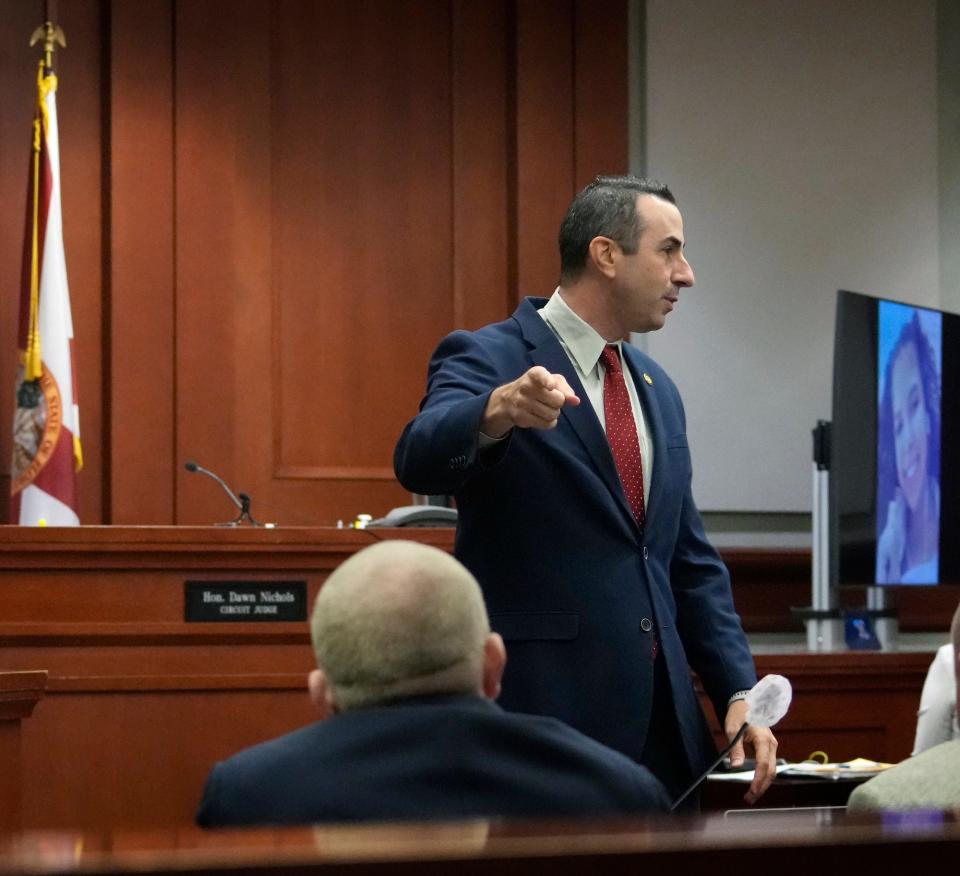 Prosecutor Jason Lewis points to Robert Kern during murder trial at the Volusia County Court House in DeLand, Monday, Aug. 8, 2022.