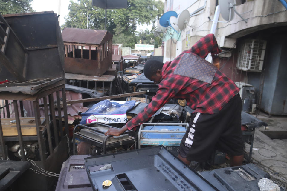 A man starts a petrol generator at his shop in Abuja, Nigeria. Saturday June 17, 2023. Nigeria's removal of a subsidy that helped reduce the price of gasoline has increased costs for people already struggling with high inflation. But it also potentially accelerates progress toward reducing emissions in Africa's largest economy. (AP Photo/Olamikan Gbemiga)