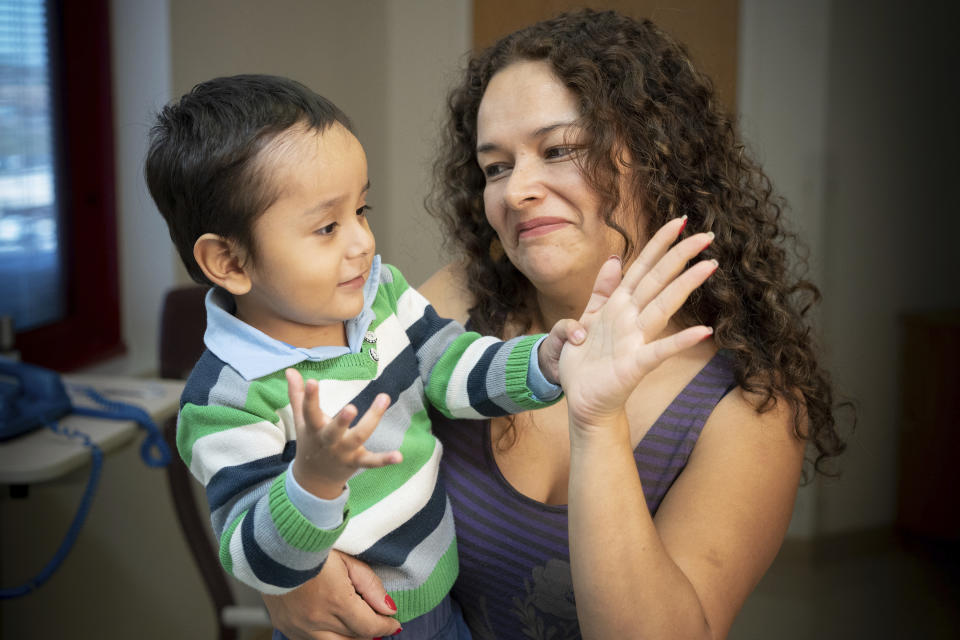 In this April 2019 photo provided by the St. Jude Children's Research Hospital, 2-year-old Gael Jesus Pino Alva is held by his mother, Giannina Alva, at the hospital in Memphis. Gael was one of eight babies with "bubble boy disease" who have had it corrected by gene therapy that ironically was made from one of the immune system's worst enemies _ HIV, the virus that causes AIDS. (Peter Barta/St. Jude Children's Research Hospital via AP)