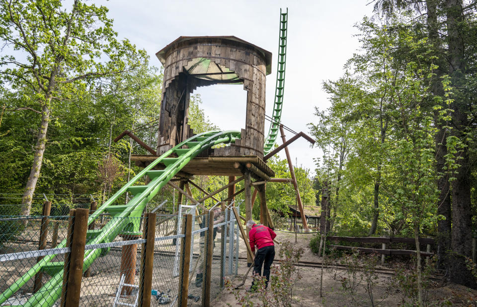 Work is underway at the new roller coaster "Saven" (The Saw), as Faarup Sommerland theme park prepares for opening day on upcoming Friday, near Blokhus in Jutland, Denmark, Thursday June 4, 2020. Denmark continues releasing society from coronavirus lockdown, with theme parks allowed to re-open from Friday. (Henning Bagger/Ritzau Scanpix via AP)